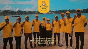 Supa Loaf team group photo during environmental clean-up activity at Madubaha Beach"